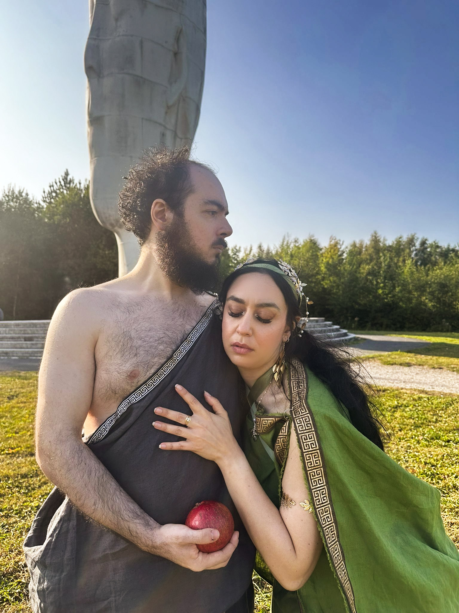 Hades and Persephone share a tender moment